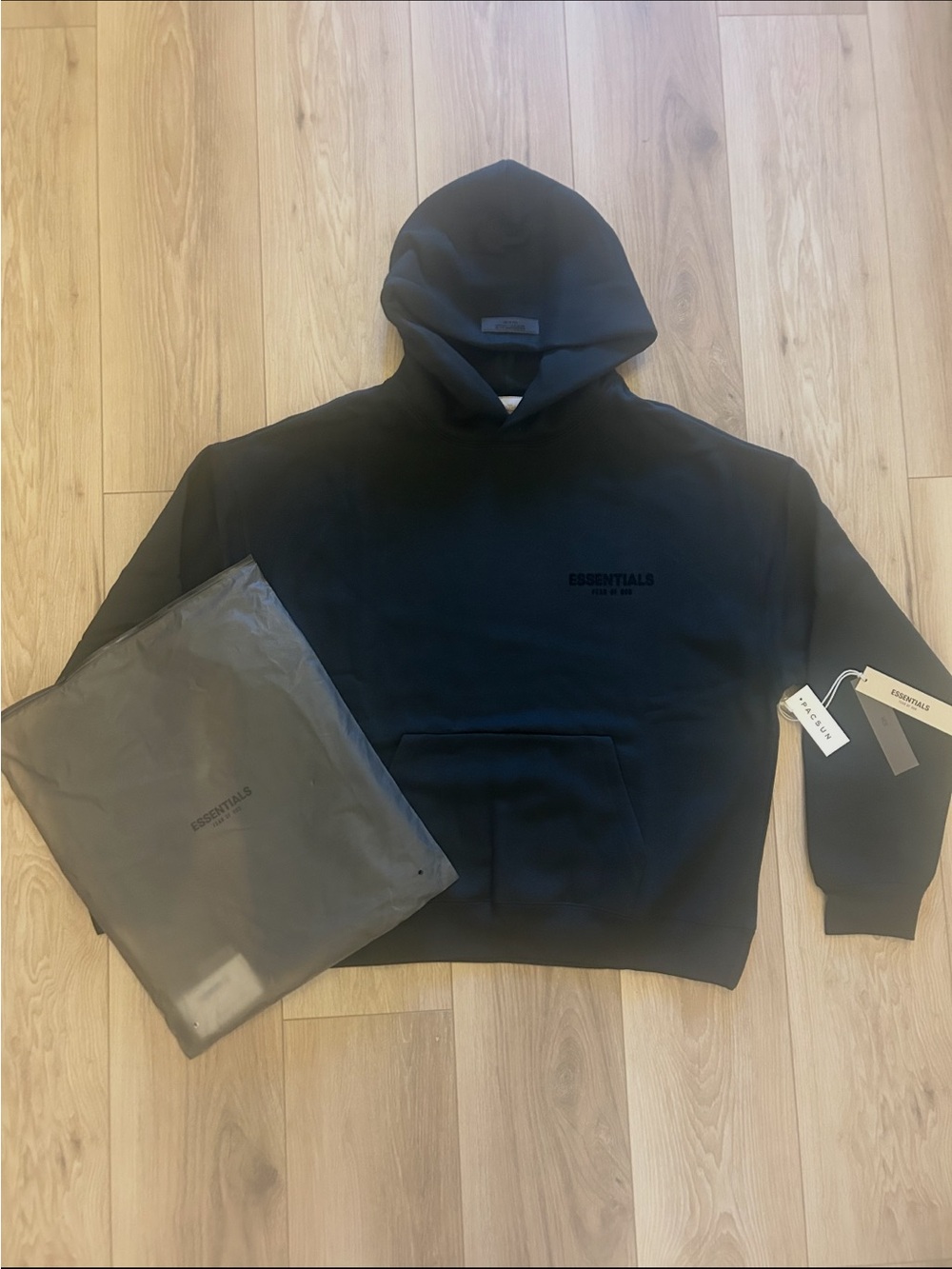 Essentials Black Men's Pullover Hoodie with Subtle Logo